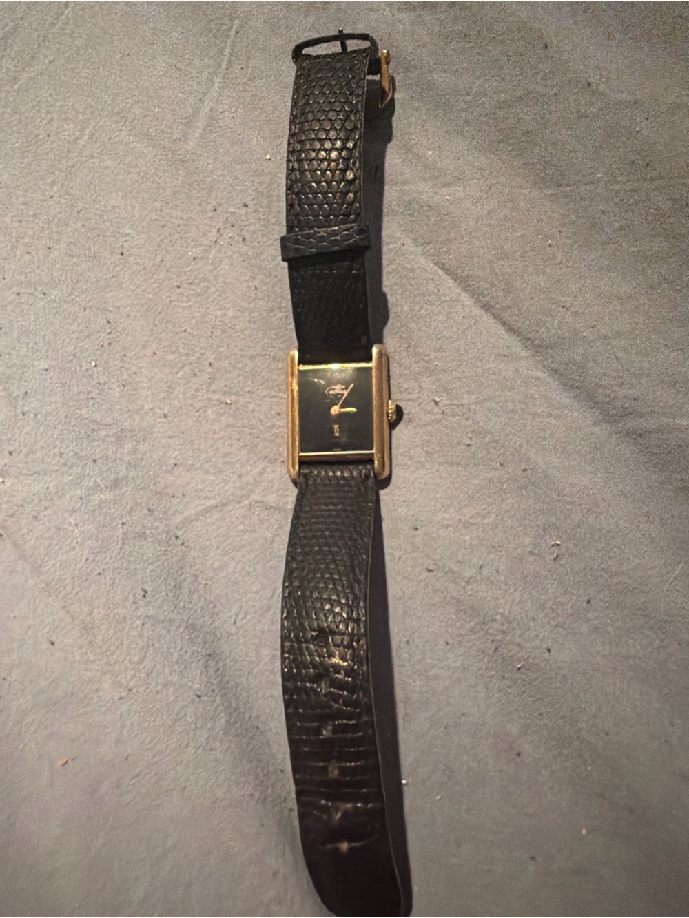Cartier women’s Black Leather Strap Watch with Gold Rectangular Case